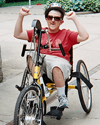 A photo of an RTS patient riding his bike.